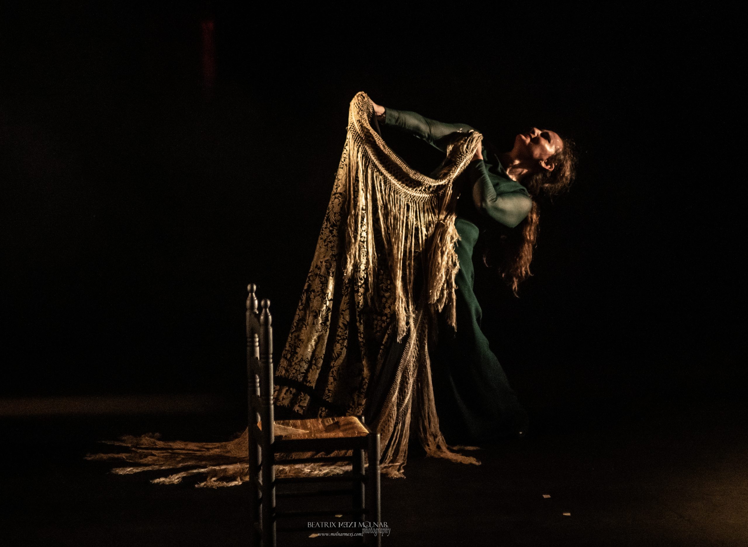 Flamenco dancer Carmen Talegona holds her manton (shawl) in an exalting pose. 